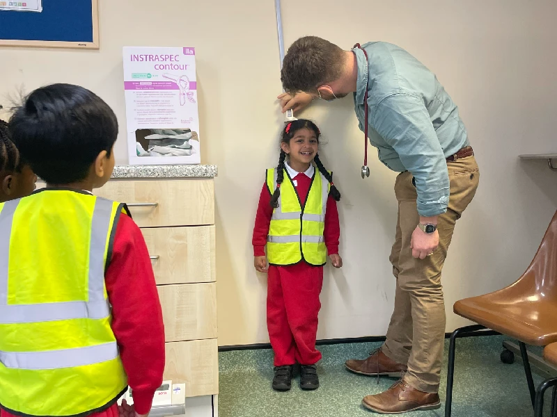 A child being measured at the Teddy GP Clinic